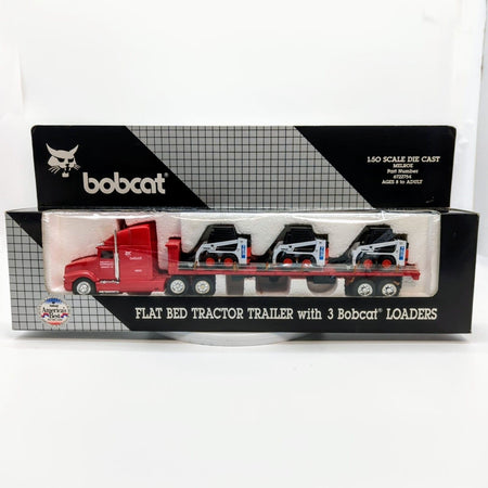 1/50 Kenworth Flatbed Semi with 3 Bobcat 753 Skid Loaders.