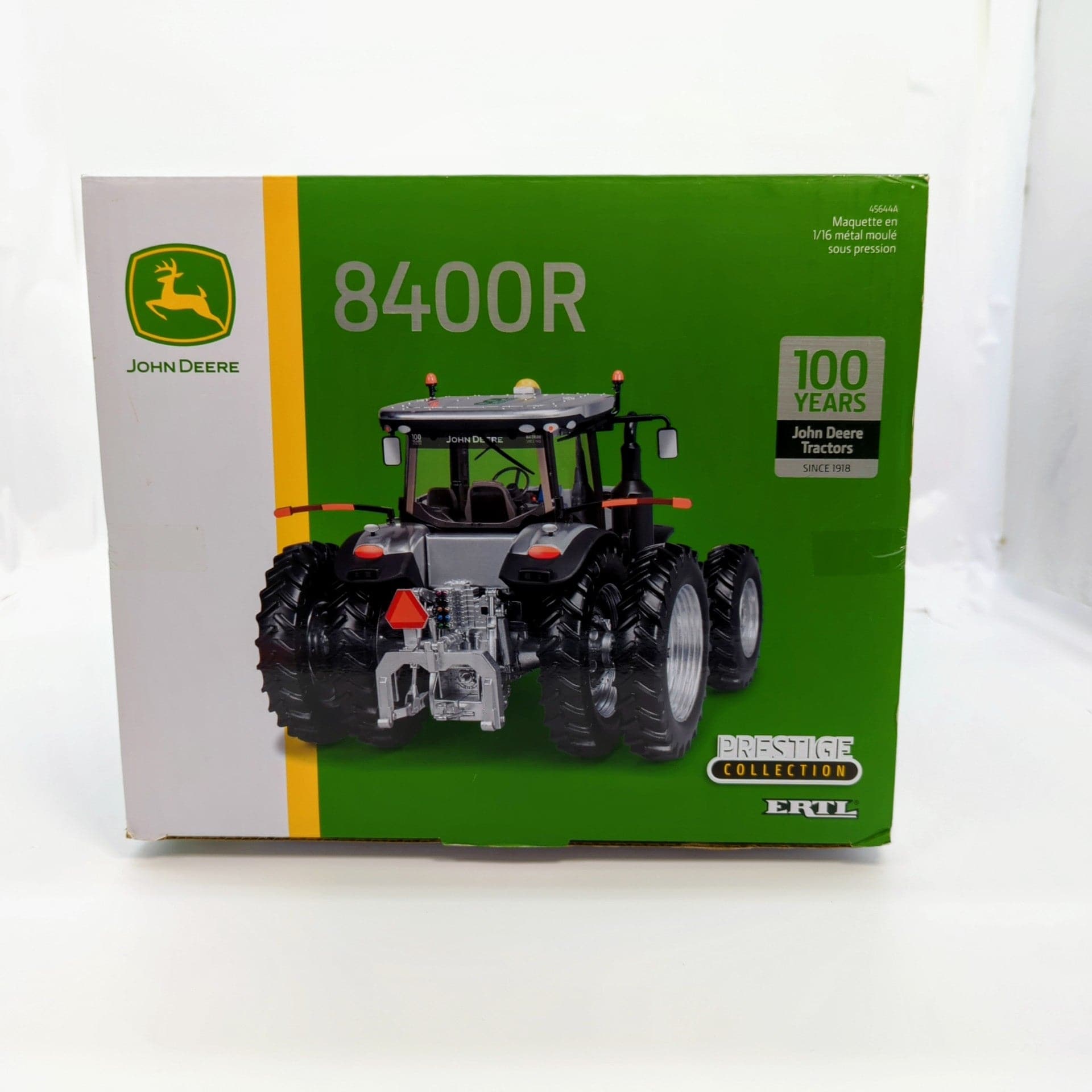 "John Deere 8400R tractor in silver color, commemorative 100 year edition"