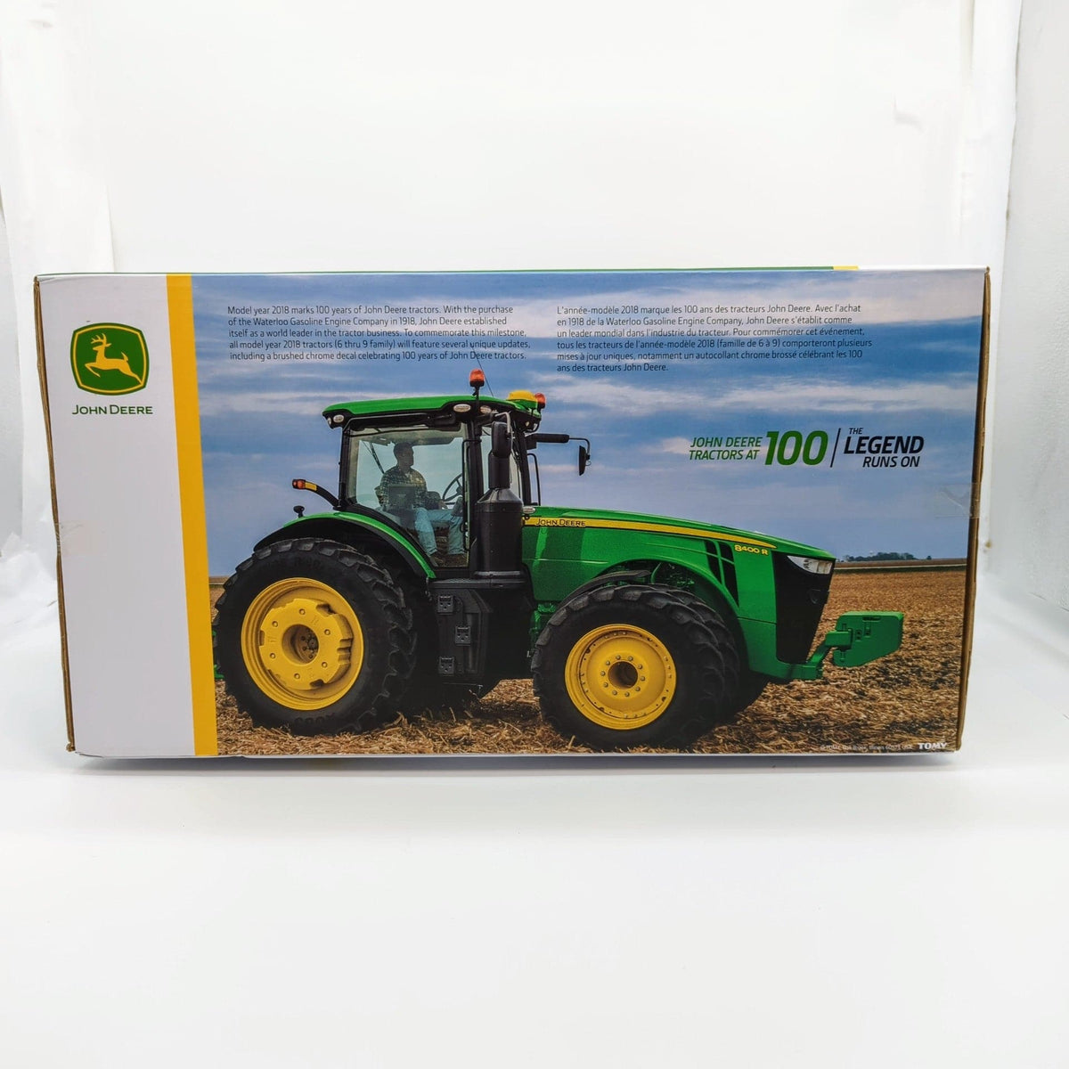 "John Deere 8400R tractor in silver color, commemorative 100 year edition"